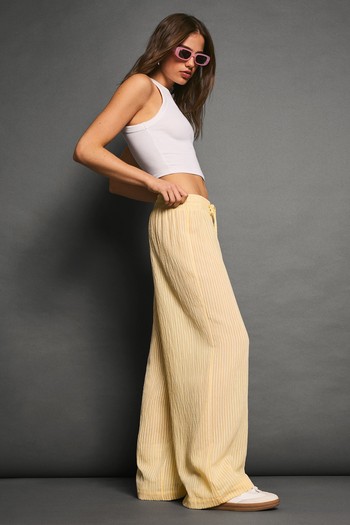 Striped Wide-Leg Creased-Effect Trousers, AED 179 | Bershka